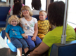 View - Audrey happily riding Trax with her Durkee cousins