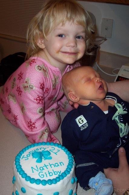 Nathan and Audrey pose with a birthday cake